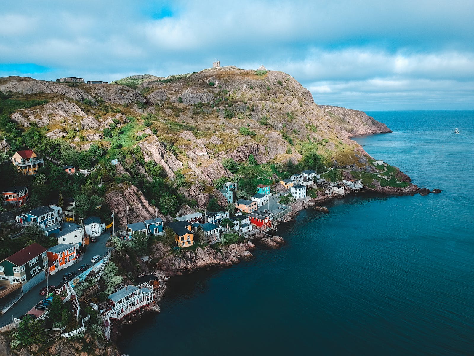 Small houses spread around rocky coast