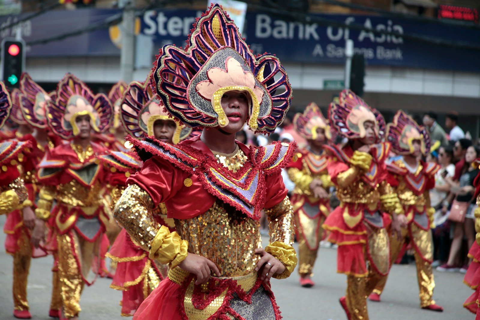 people in red and gold traditional dress