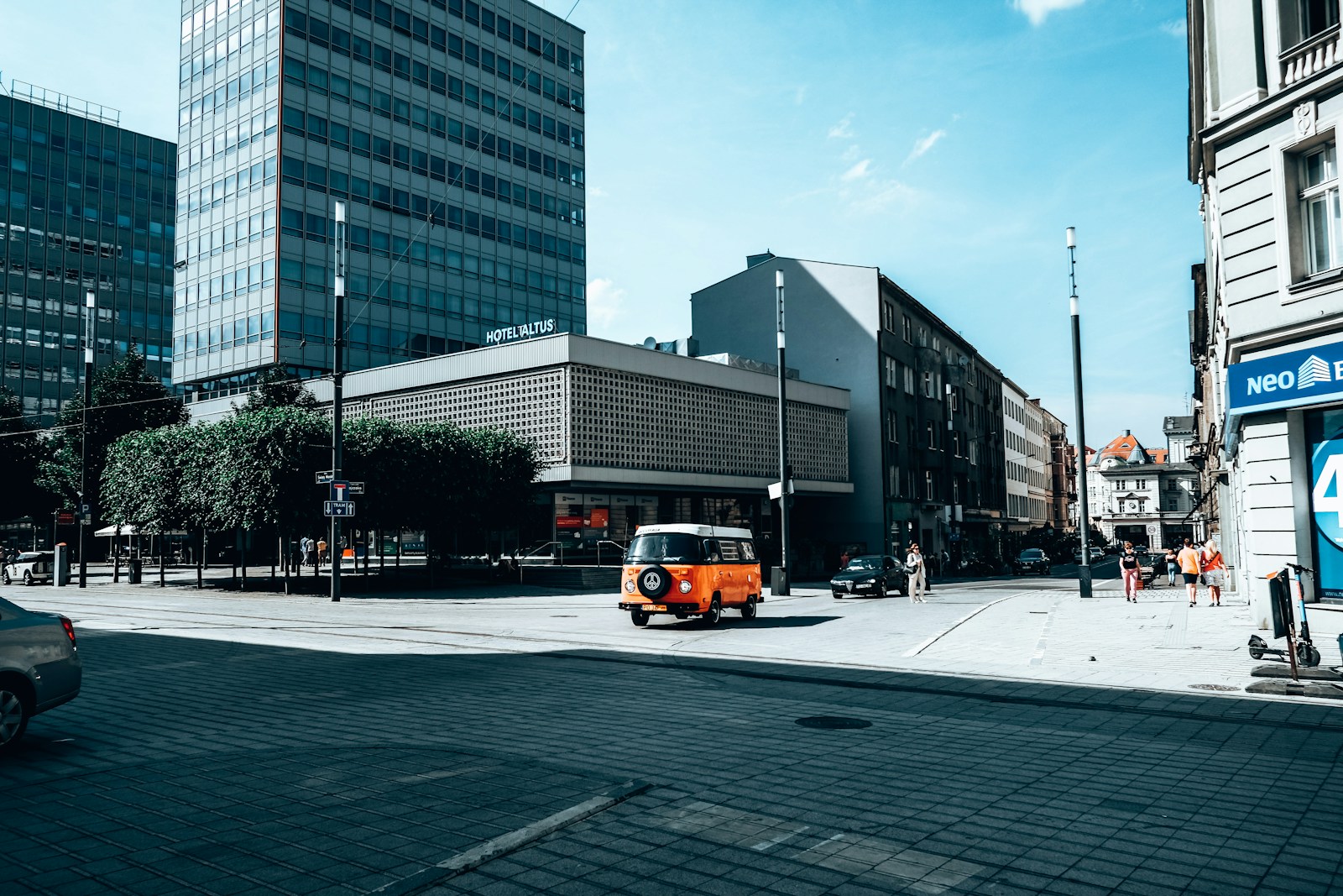 a street with cars and buildings on the side