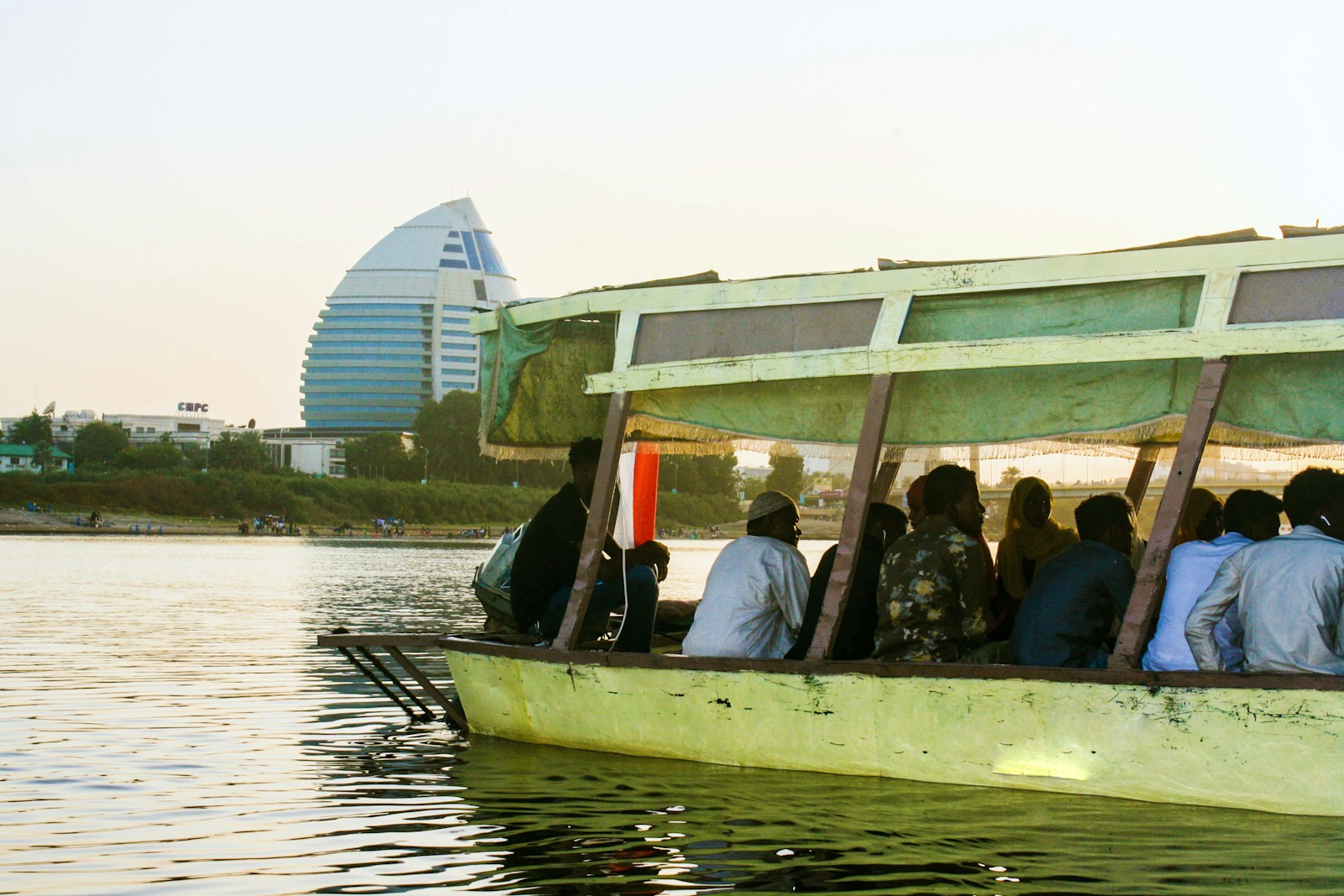 a group of people riding on the back of a boat