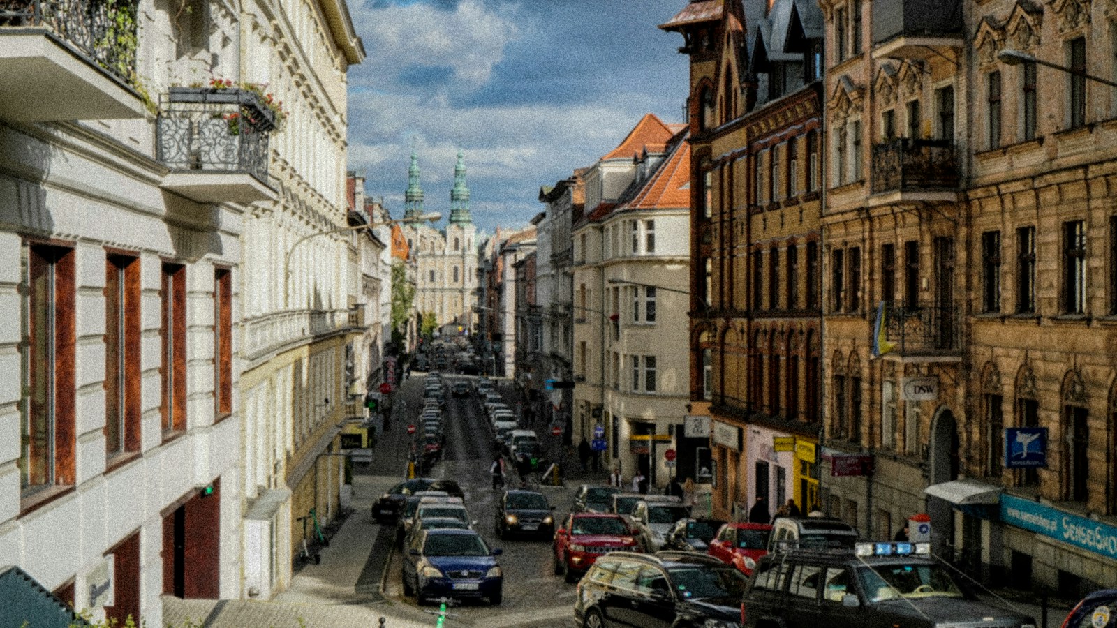 a street with cars and buildings