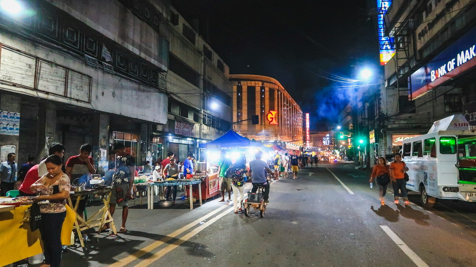 people walking on street during night time