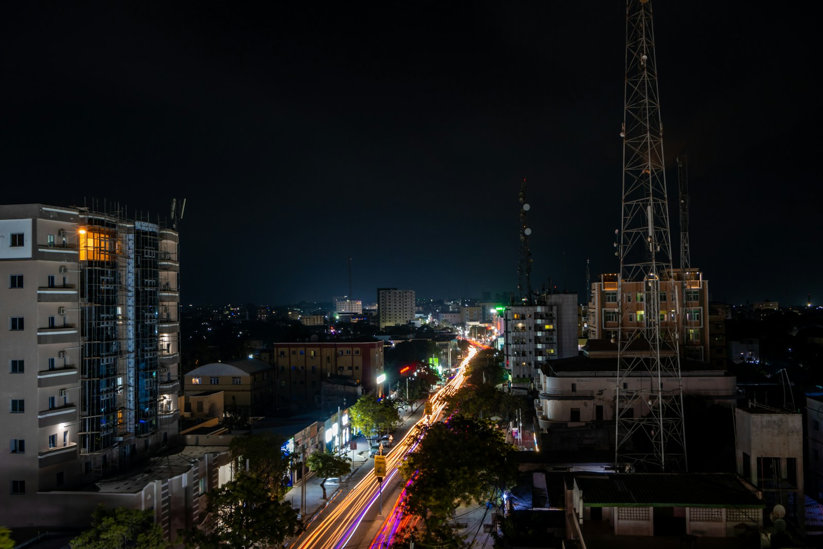 a view of a city at night from the top of a building