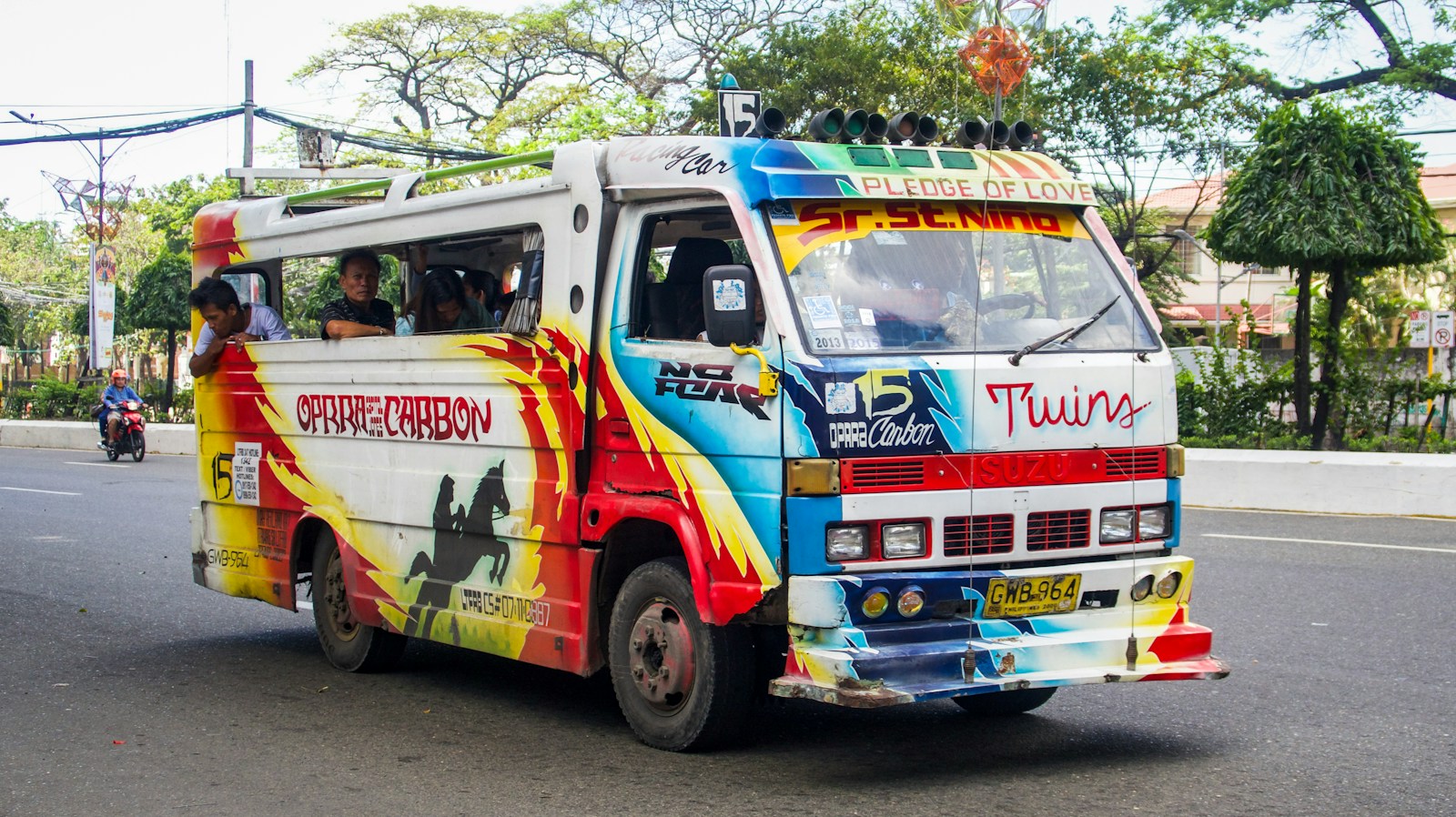 white red and blue van on road during daytime